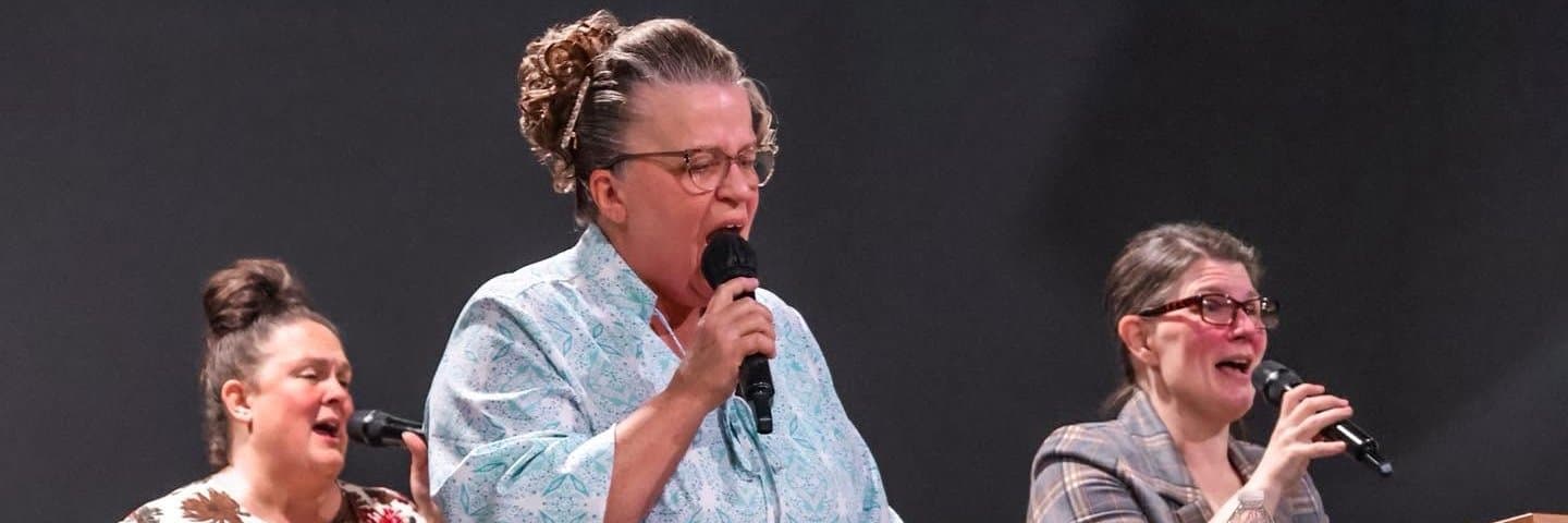 Women of the church singing during worship